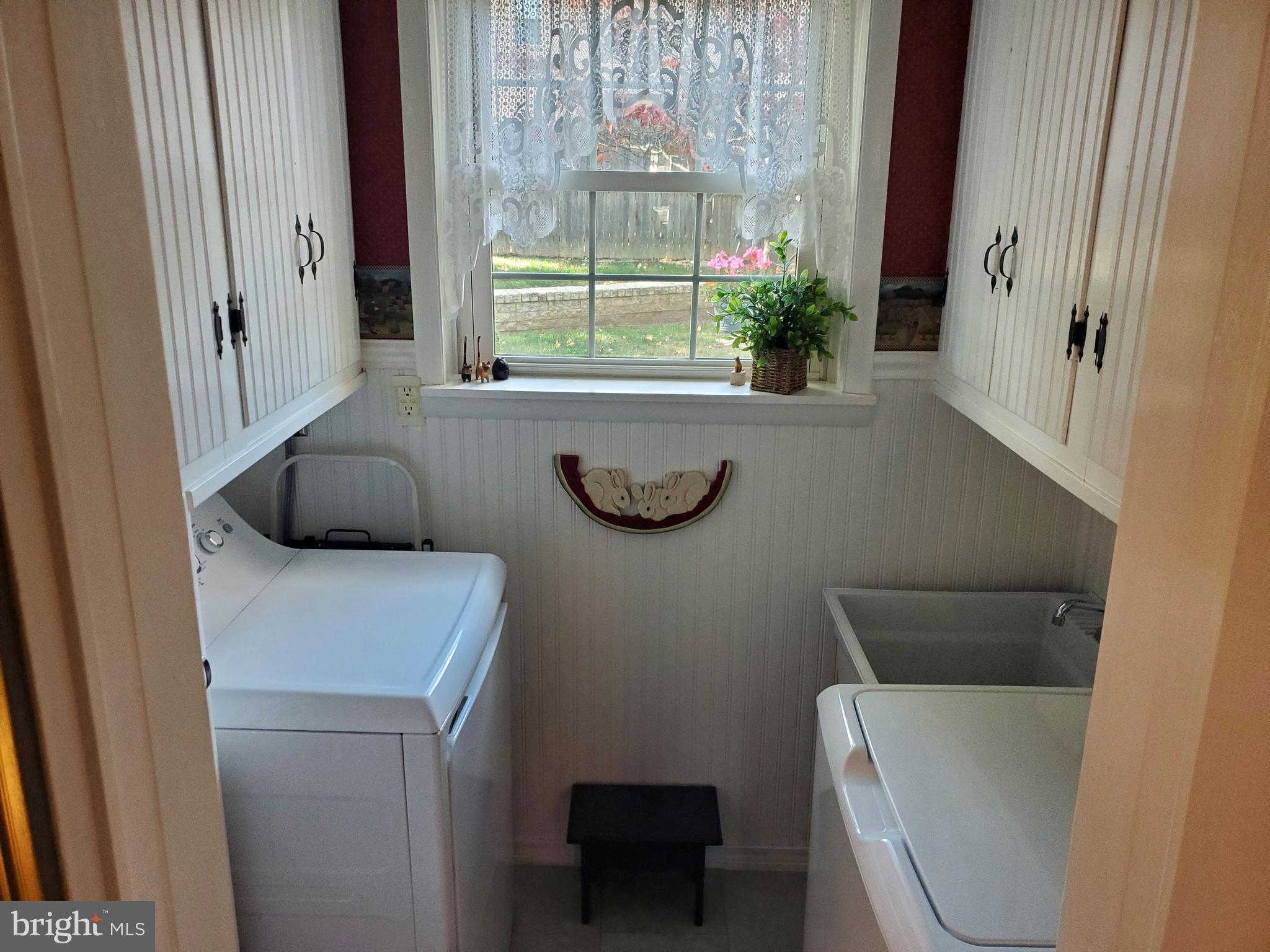 16 Robert Road New Castle, DE 19720 - Photo 16 of 30 a bathroom with a toilet a sink and a window