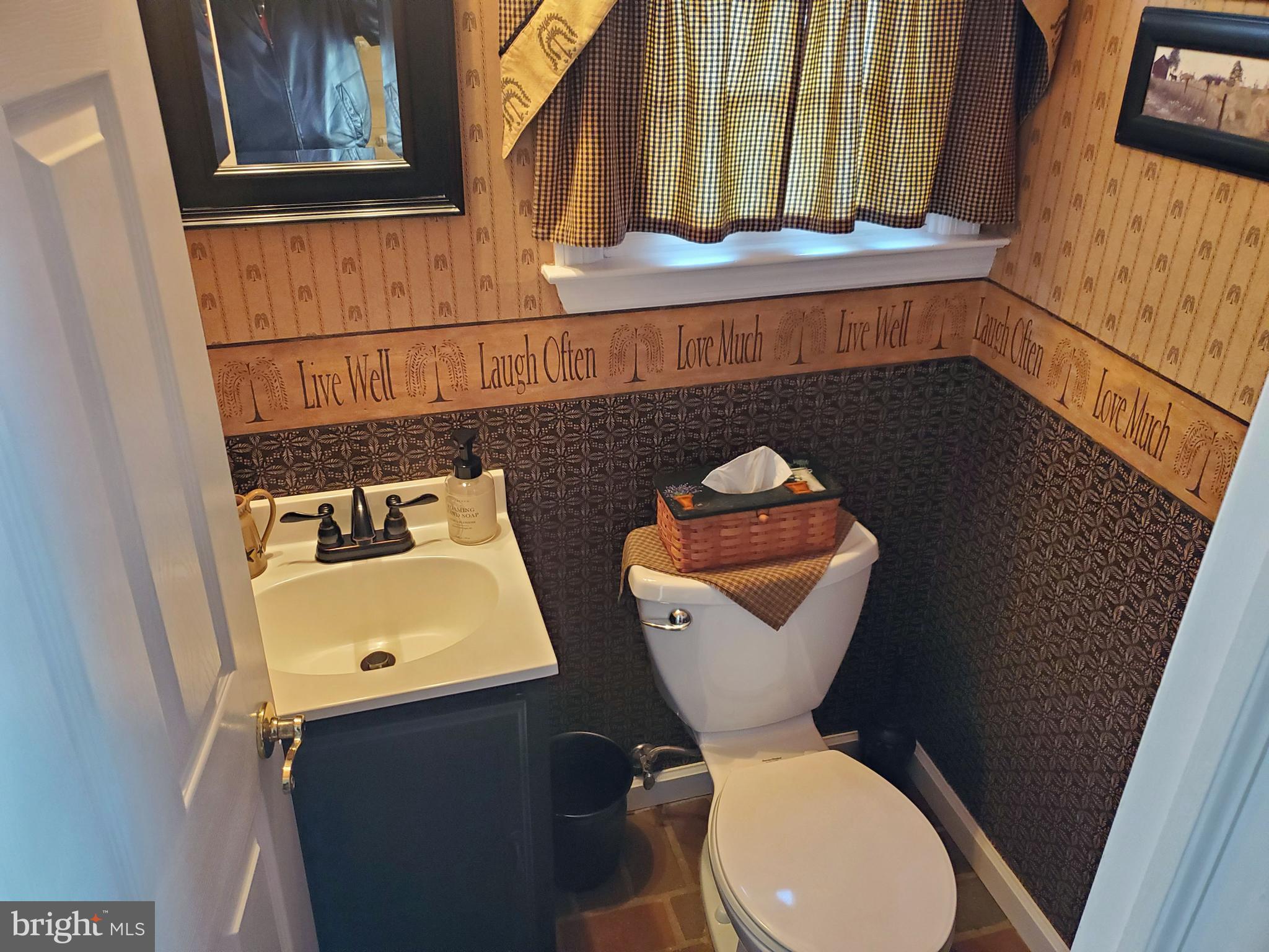 16 Robert Road New Castle, DE 19720 - Photo 17 of 30 a bathroom with a toilet sink and mirror