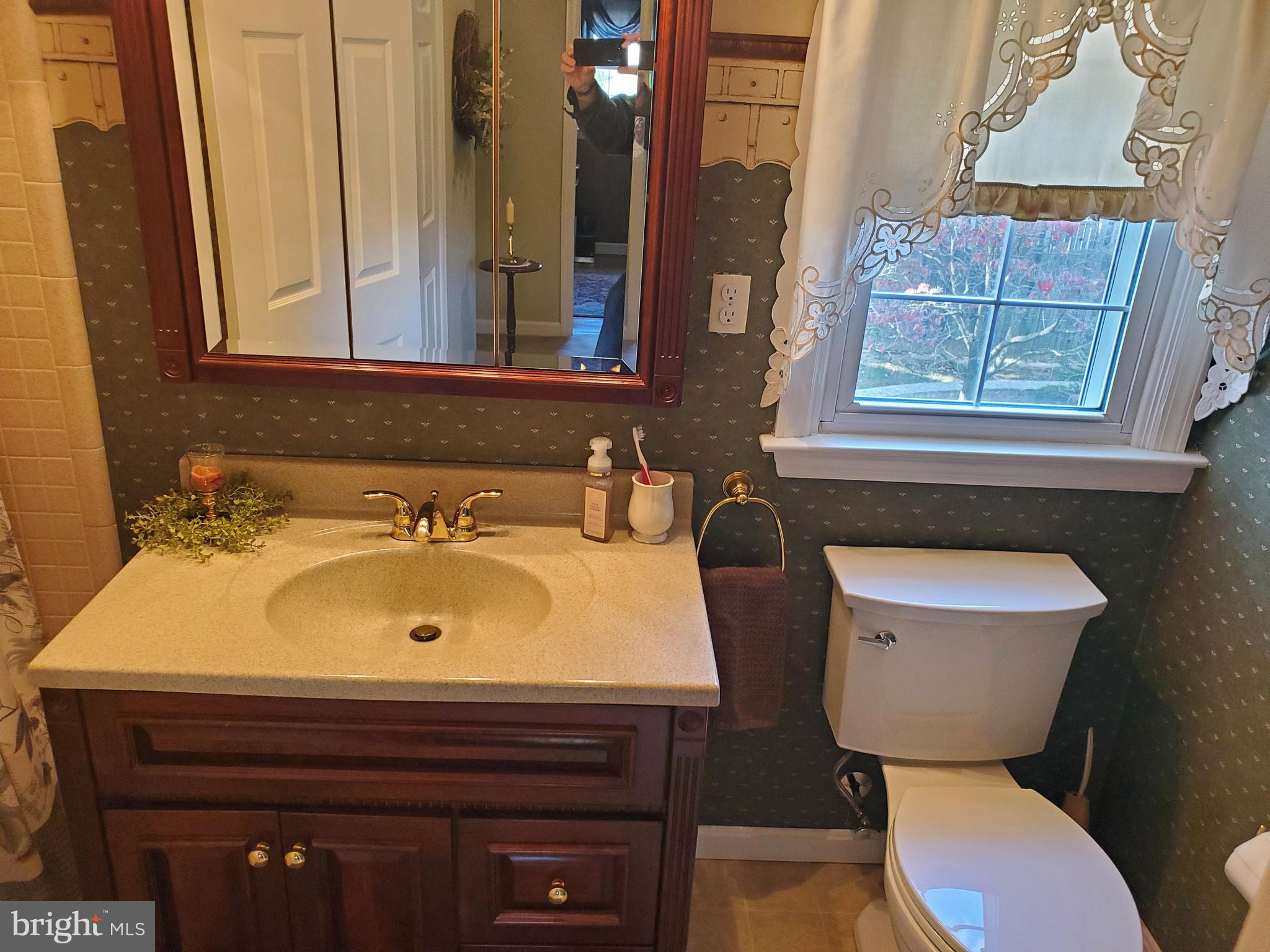 16 Robert Road New Castle, DE 19720 - Photo 8 of 30 a bathroom with a sink and a toilet