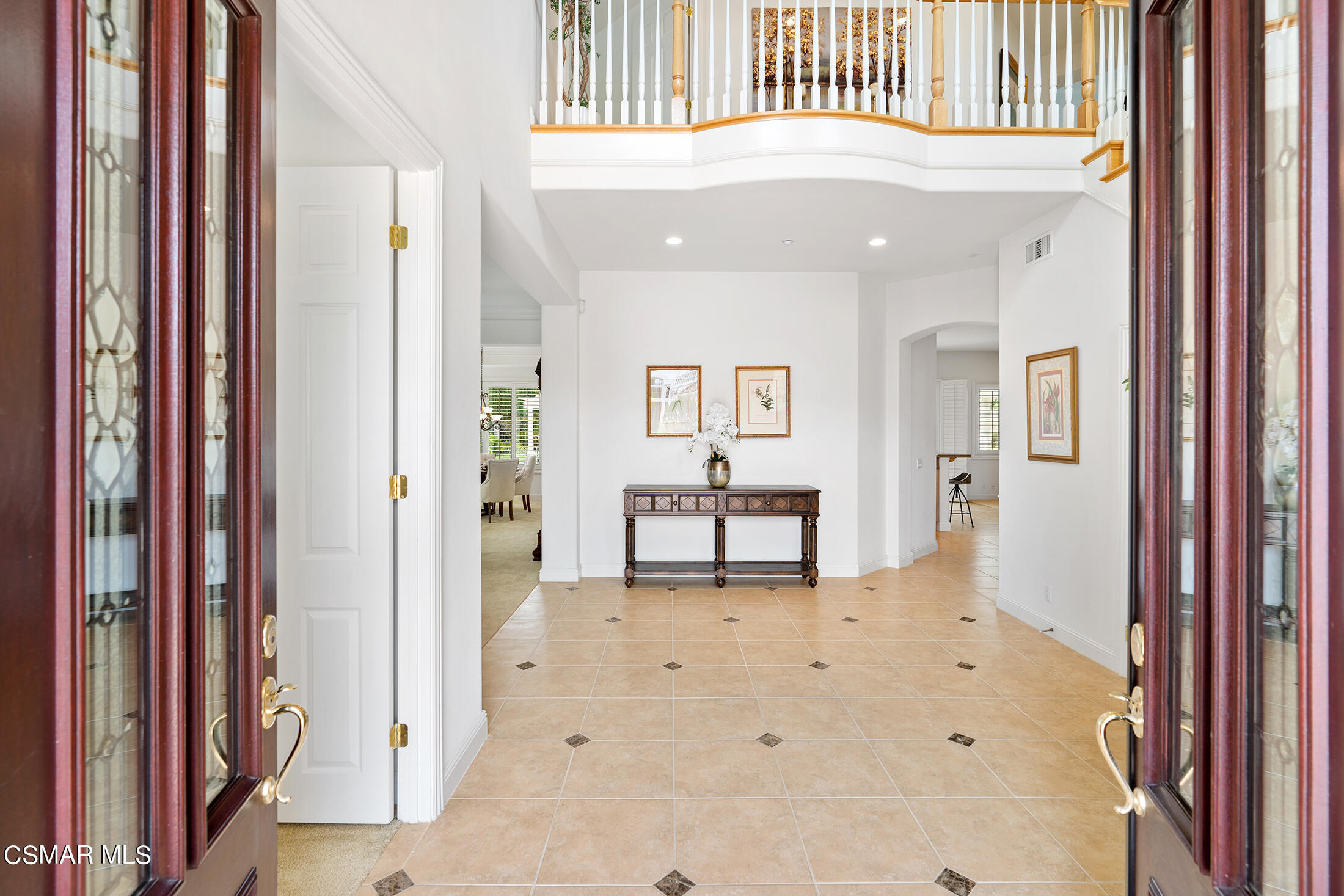 11225 Watson Drive Moorpark, CA 93021 - Photo 15 of 89 a view of a hallway with wooden floor and dining room view