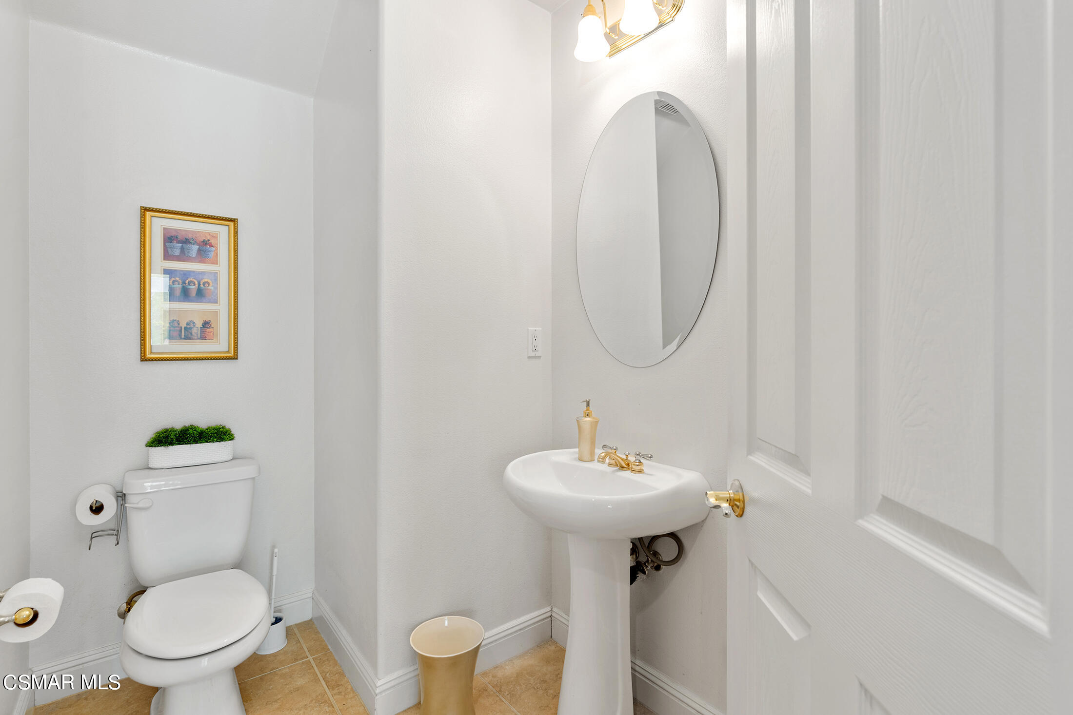 11225 Watson Drive Moorpark, CA 93021 - Photo 34 of 89 a bathroom with a toilet sink and mirror