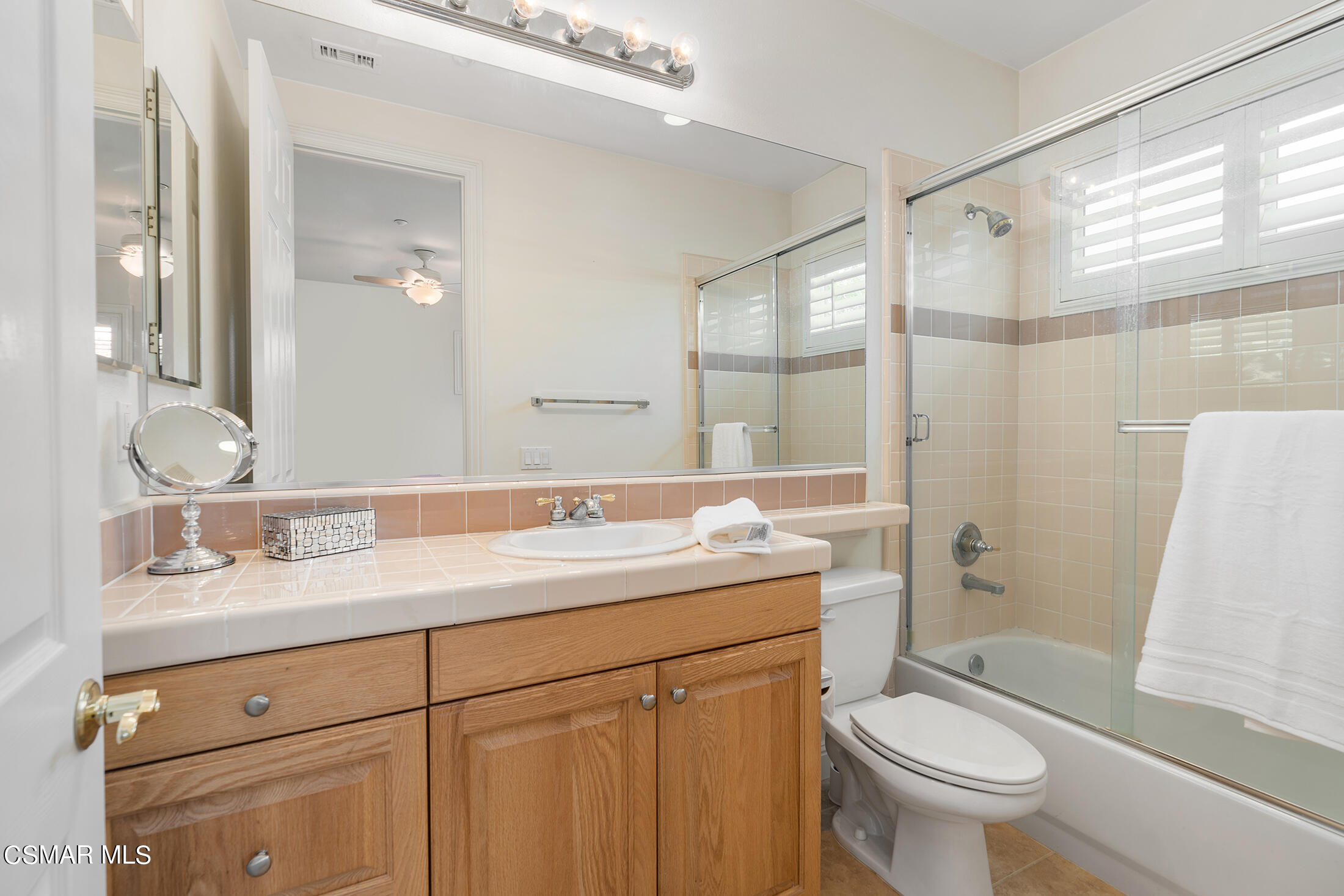 11225 Watson Drive Moorpark, CA 93021 - Photo 45 of 89 a bathroom with a sink toilet vanity and shower