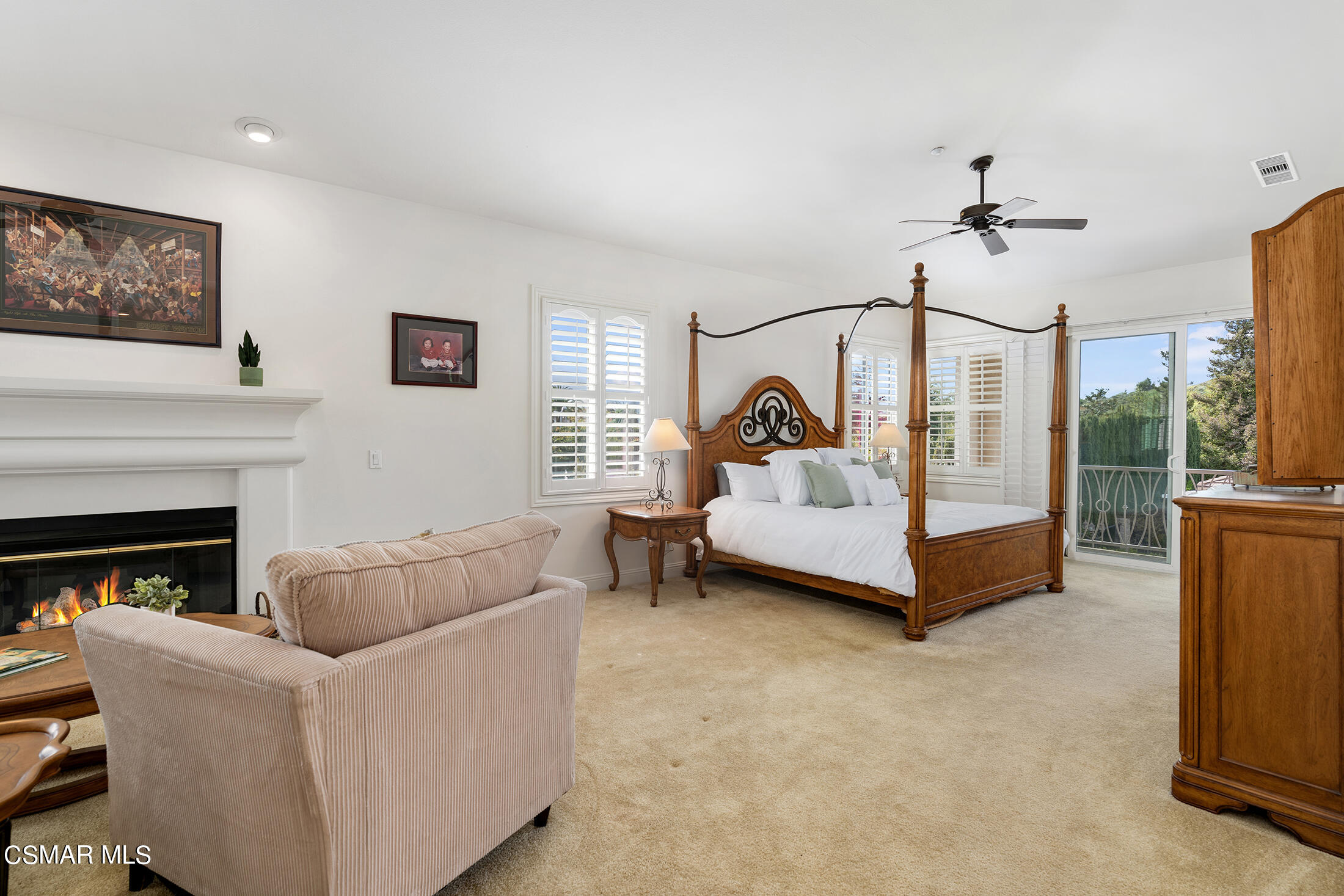 11225 Watson Drive Moorpark, CA 93021 - Photo 51 of 89 a living room with furniture a fireplace and a flat screen tv
