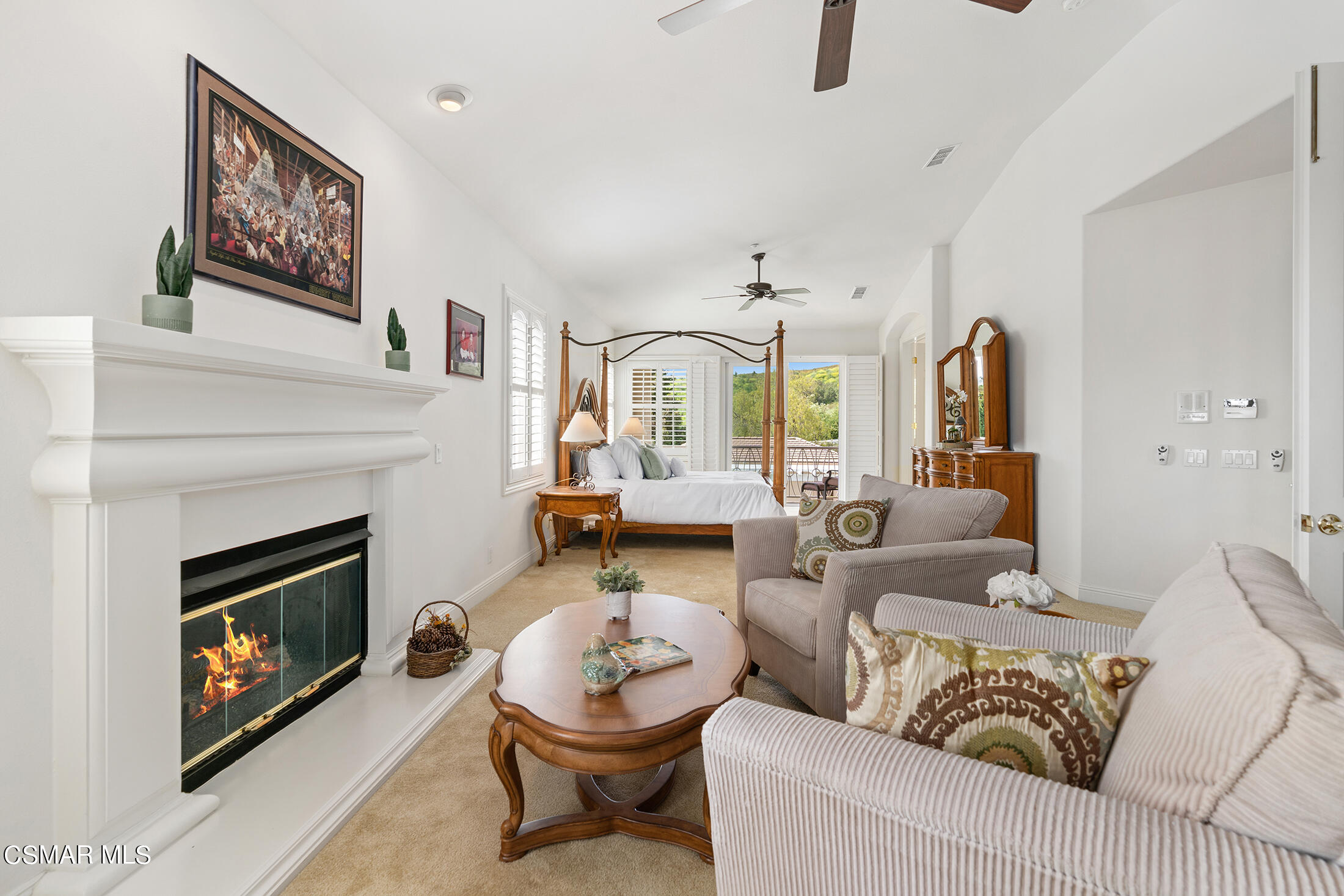 11225 Watson Drive Moorpark, CA 93021 - Photo 53 of 89 a living room with furniture a flat screen tv and a fireplace