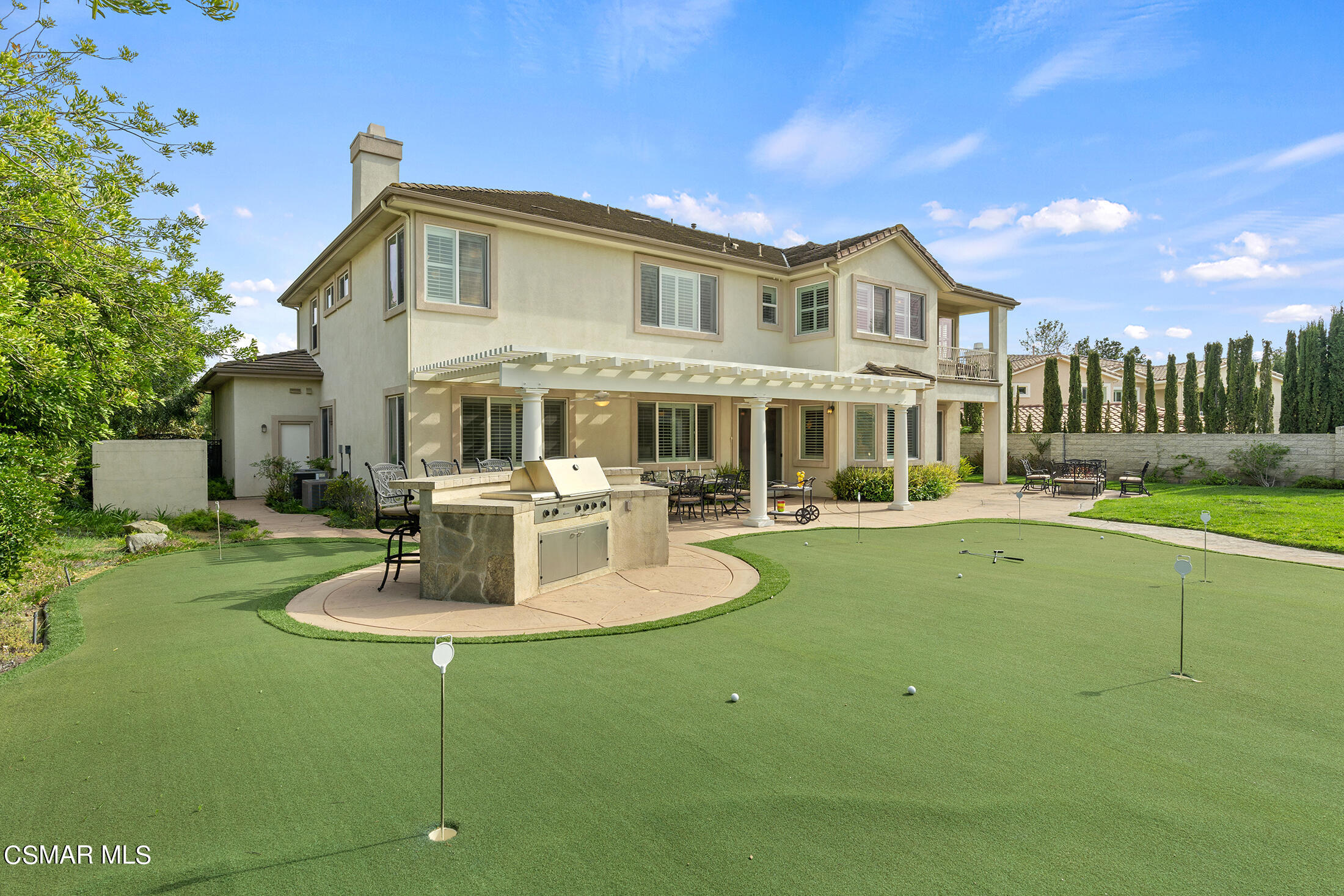 11225 Watson Drive Moorpark, CA 93021 - Photo 66 of 89 a front view of a house with a yard table and chairs