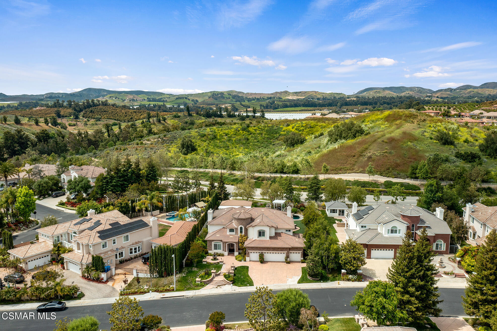 11225 Watson Drive Moorpark, CA 93021 - Photo 7 of 89 an aerial view of a city with lots of residential buildings and mountain view in back