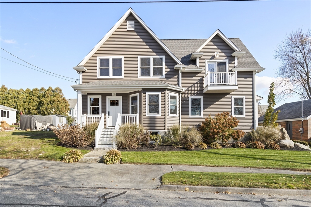a front view of a house with a yard