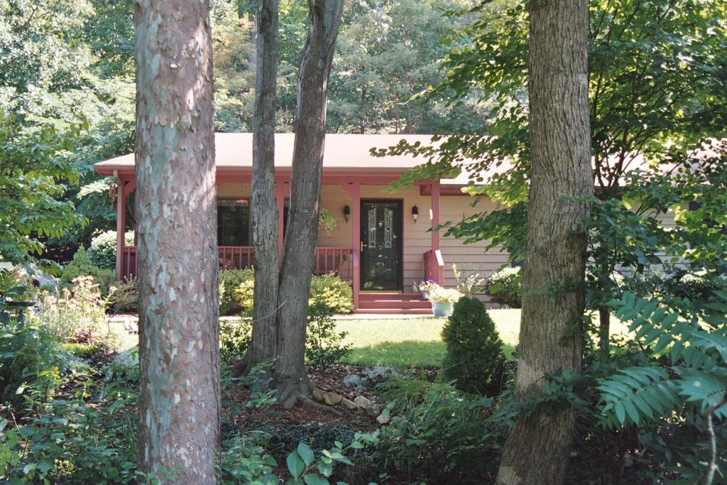 2644 Blue Ridge Springs Road Blue Ridge, VA 24064 - Photo 8 of 10 a view of a house with a tree in front of it