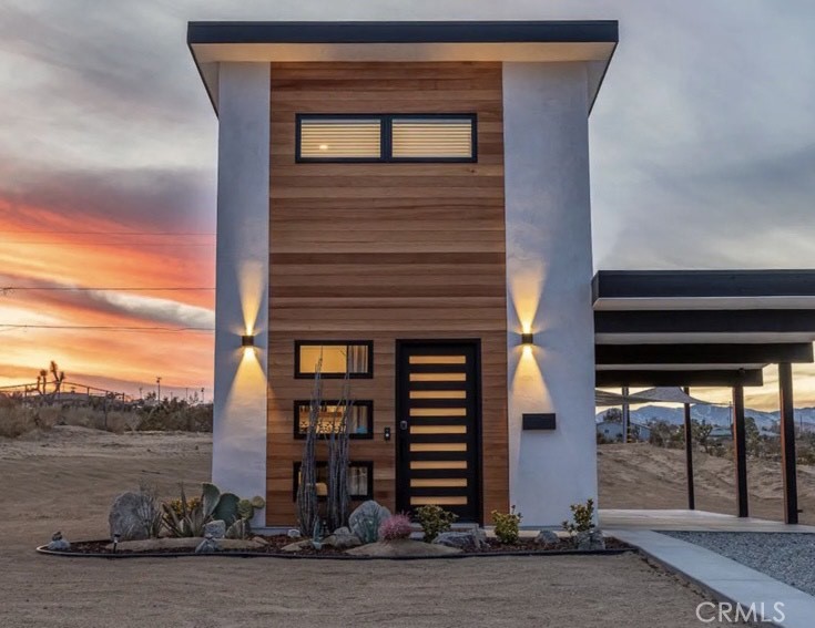 7394 Olympic Road Joshua Tree, CA 92252 - Photo 1 of 1 a front view of a house with a yard