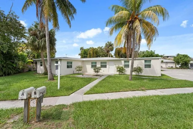 a view of a backyard with swimming pool