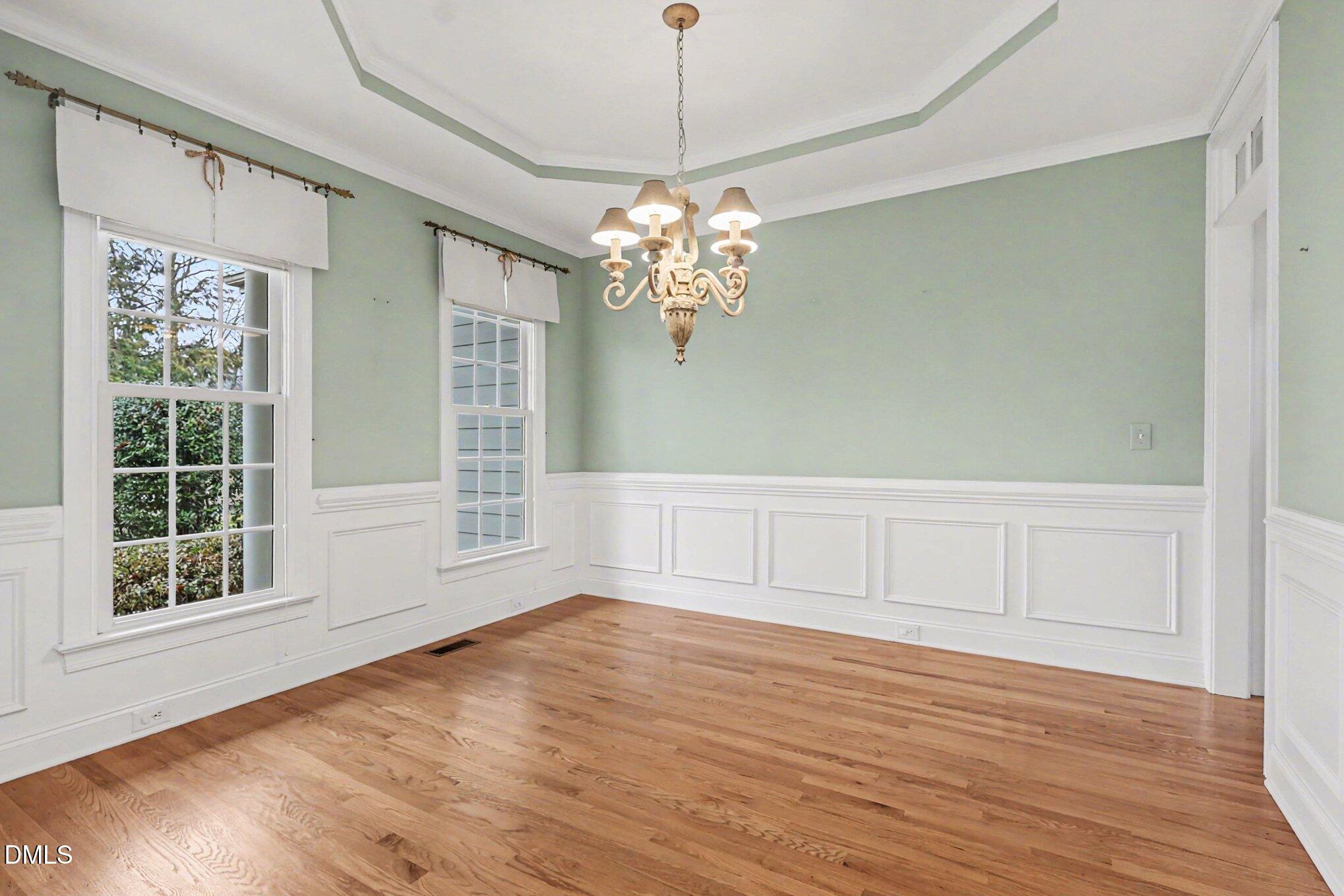1108 Neuse Ridge Drive Clayton, NC 27527 - Photo 13 of 52 a view of wooden floor and chandelier in a room
