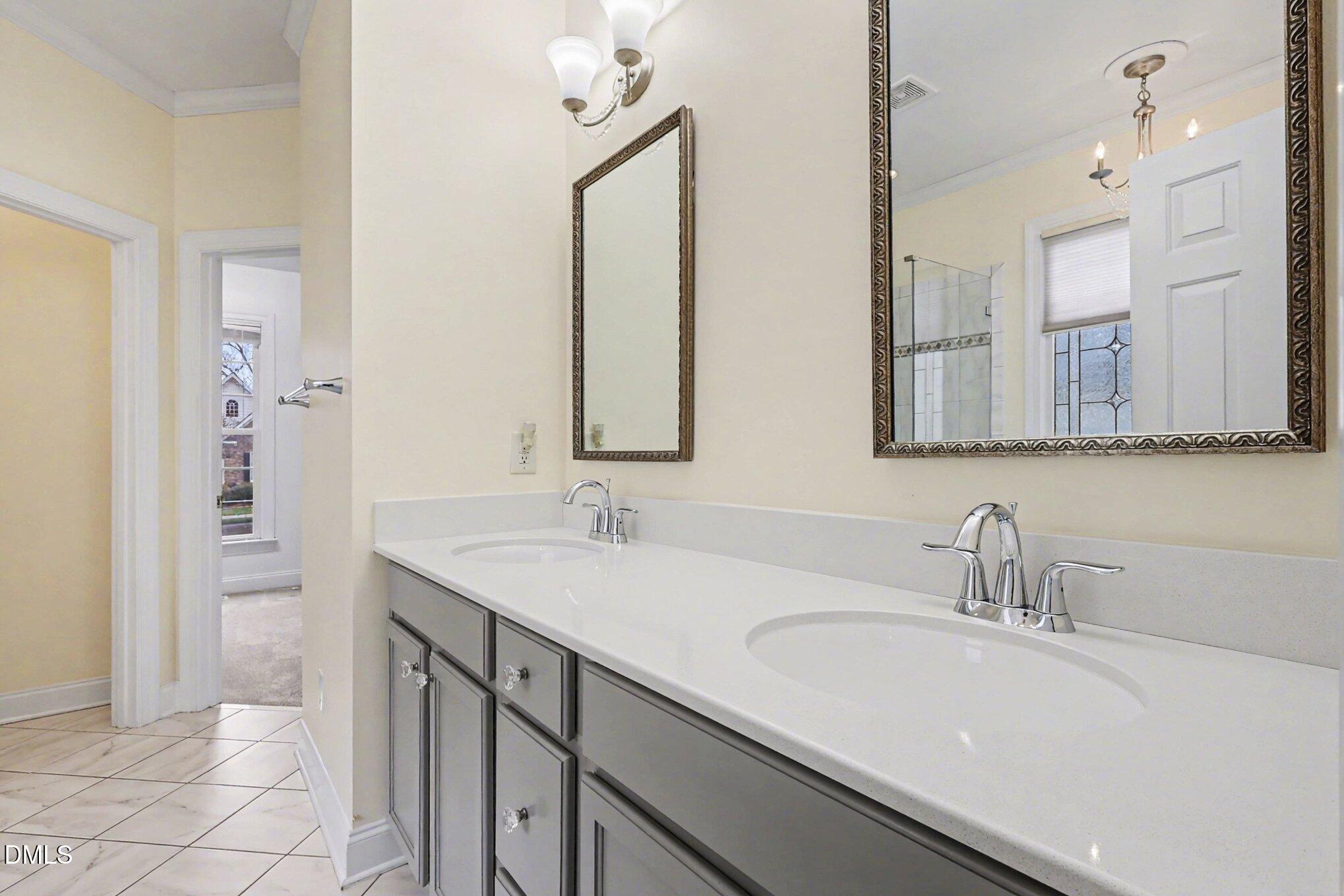 1108 Neuse Ridge Drive Clayton, NC 27527 - Photo 26 of 52 a bathroom with a sink and a mirror