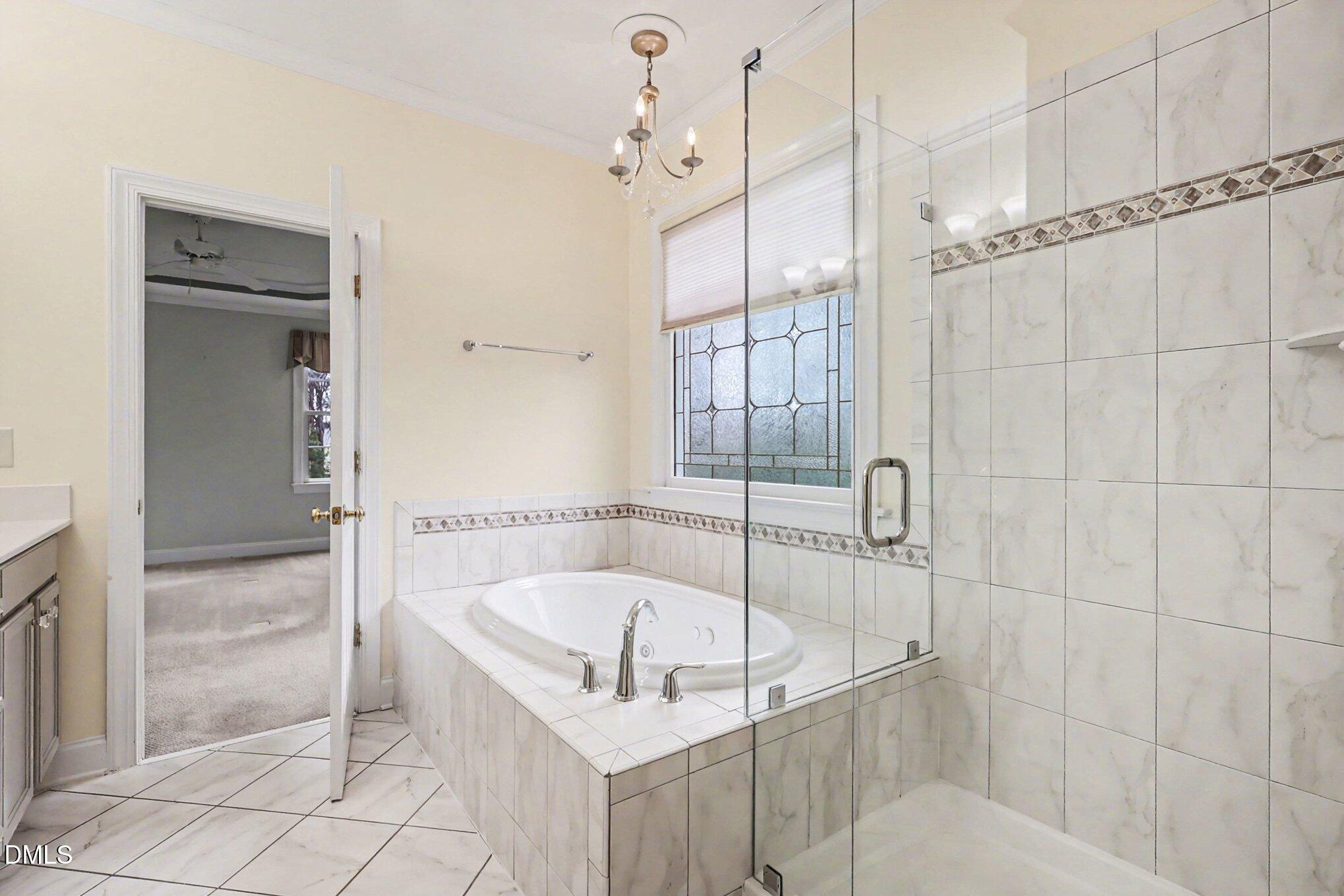 1108 Neuse Ridge Drive Clayton, NC 27527 - Photo 27 of 52 a white bath tub sitting next to a shower