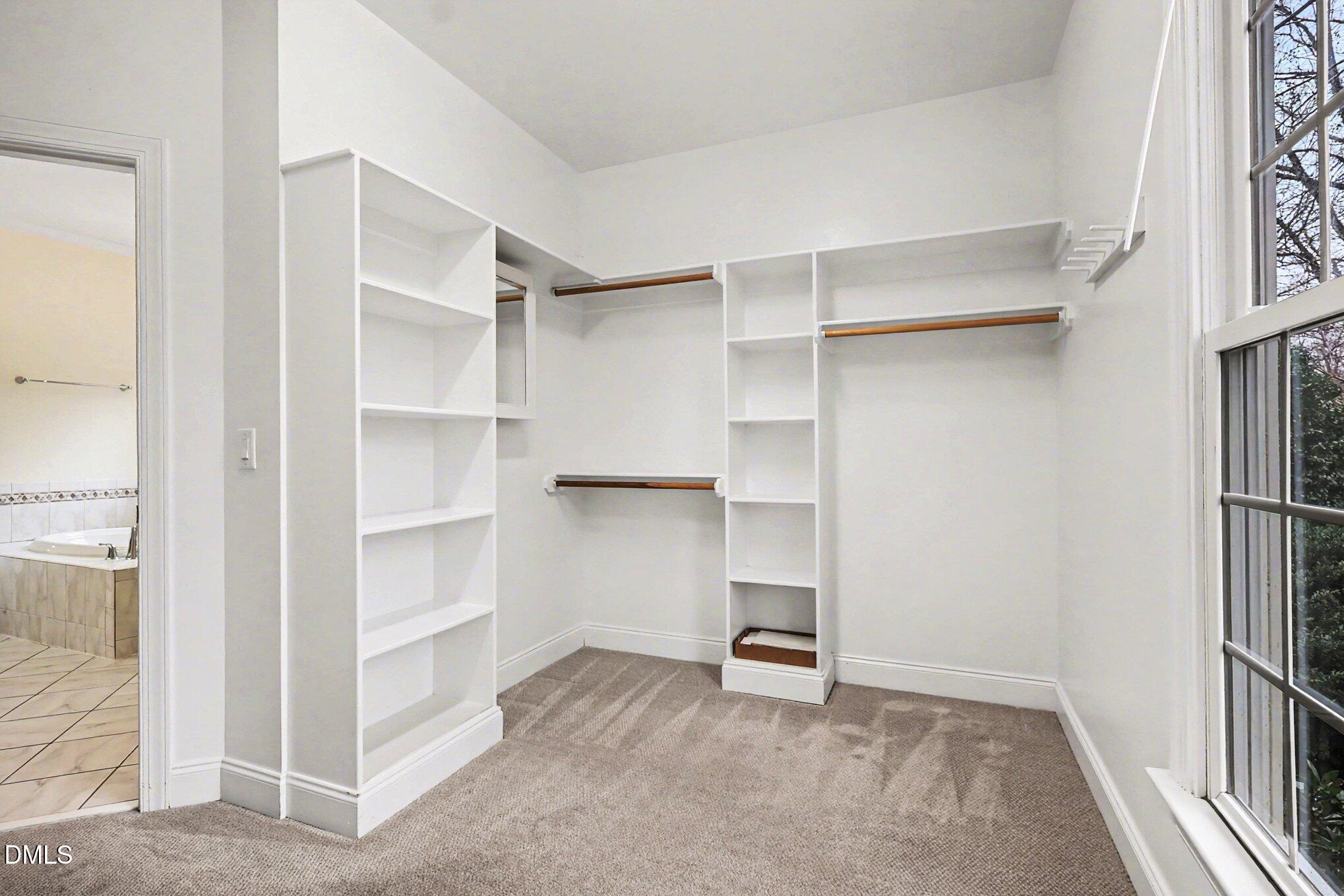 1108 Neuse Ridge Drive Clayton, NC 27527 - Photo 28 of 52 a view of walk in closet with empty racks