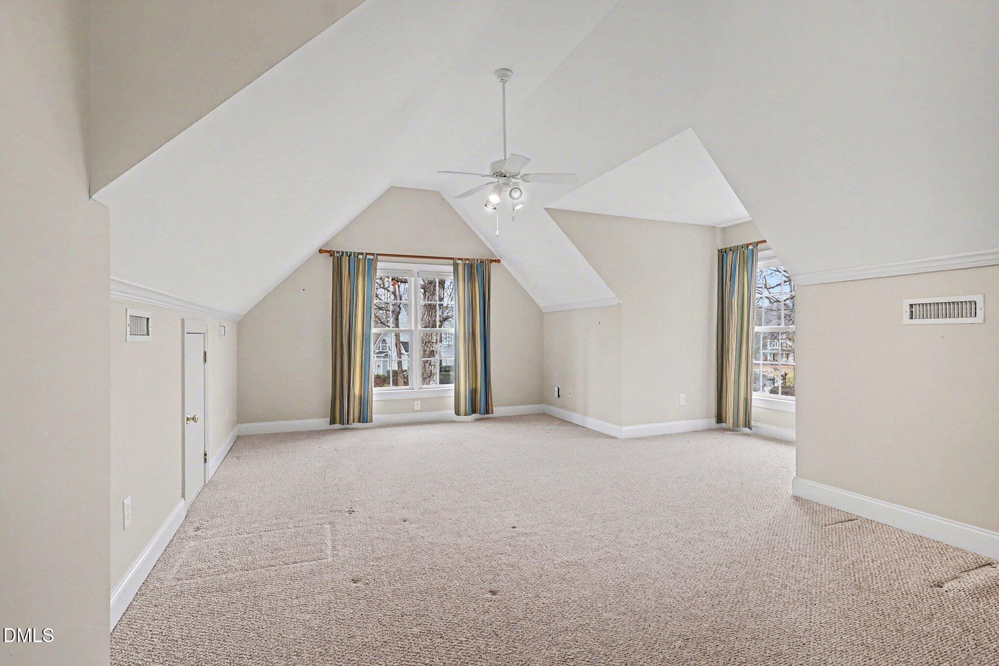 1108 Neuse Ridge Drive Clayton, NC 27527 - Photo 29 of 52 an empty room with windows and fan