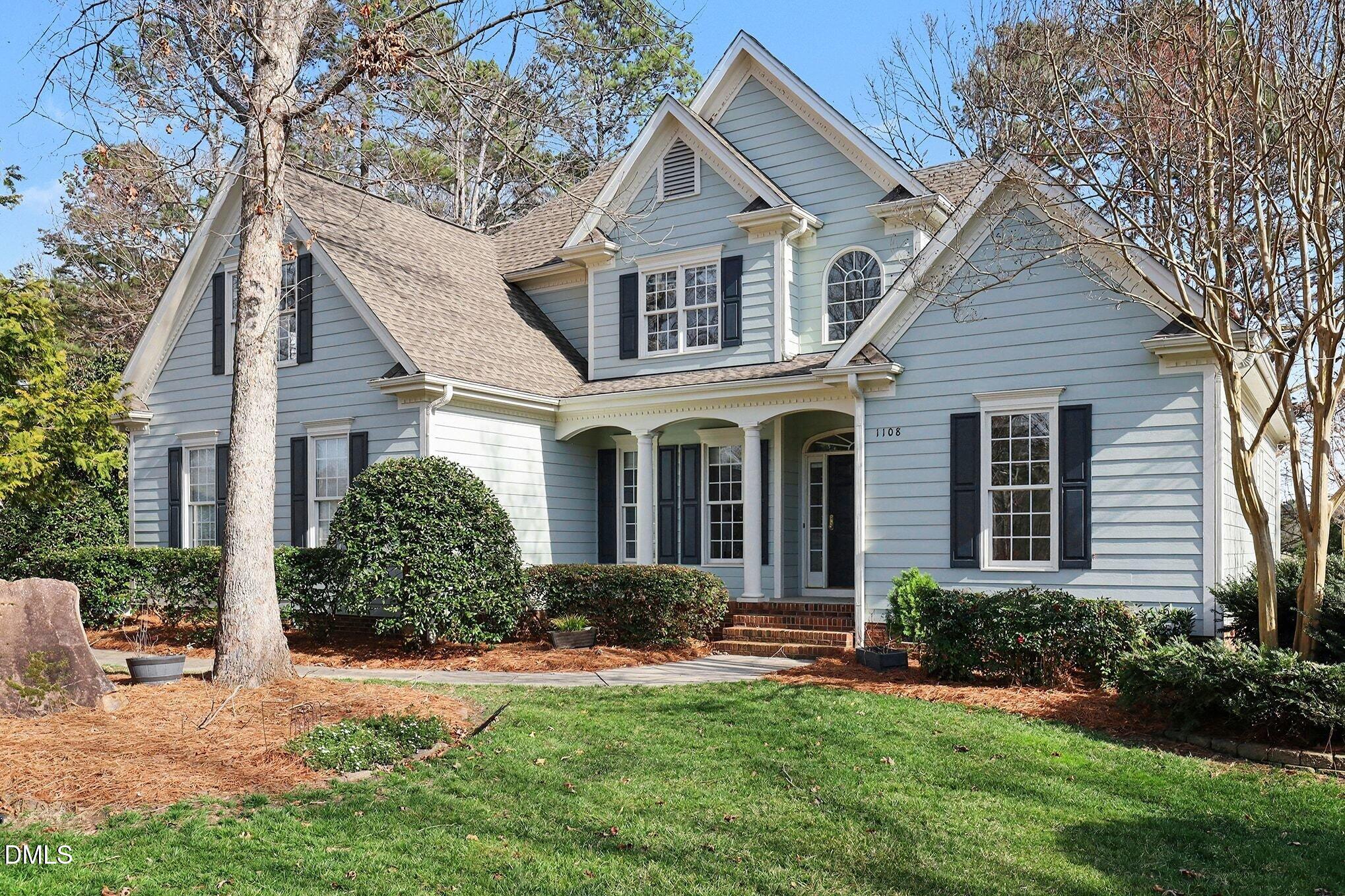 1108 Neuse Ridge Drive Clayton, NC 27527 - Photo 2 of 52 a front view of a house with a yard and porch