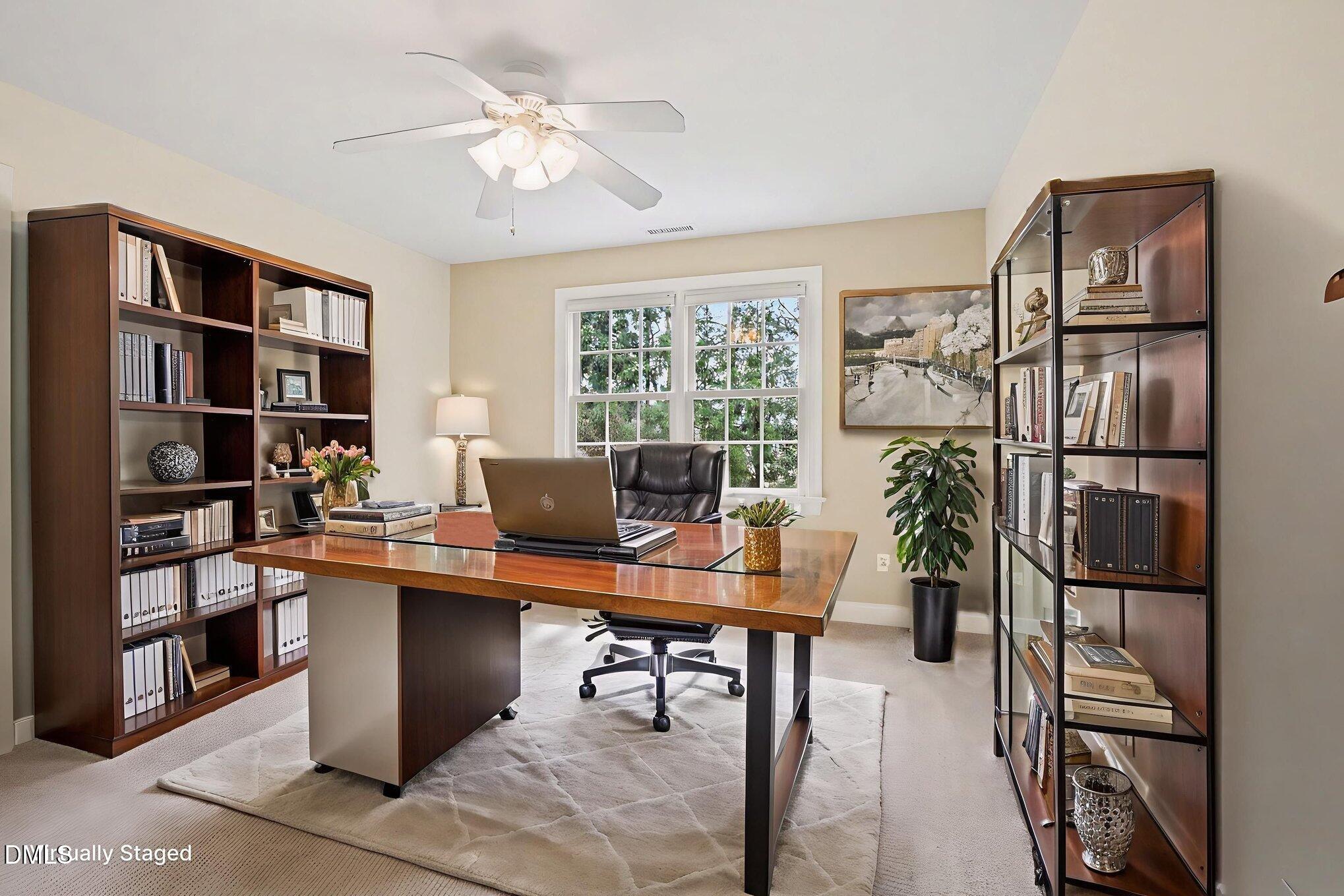 1108 Neuse Ridge Drive Clayton, NC 27527 - Photo 32 of 52 a view of a workspace with furniture and a bookshelf