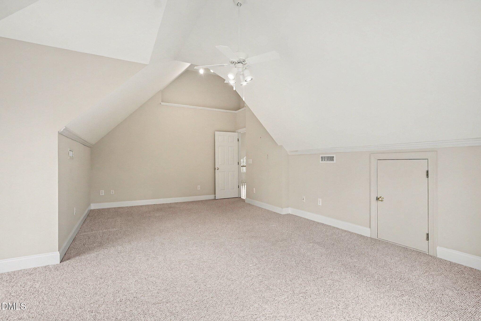 1108 Neuse Ridge Drive Clayton, NC 27527 - Photo 35 of 52 a view of an empty room with a ceiling fan