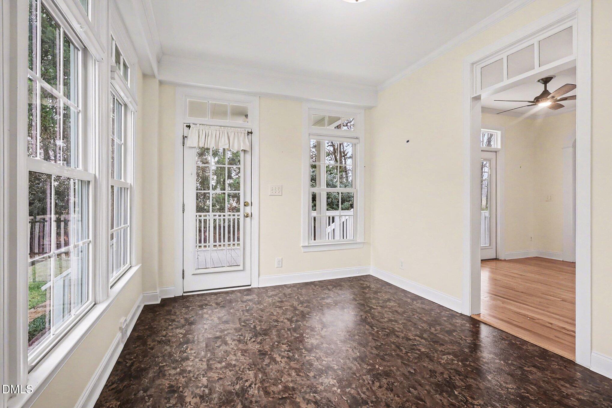1108 Neuse Ridge Drive Clayton, NC 27527 - Photo 39 of 52 a view of an empty room with wooden floor and a window