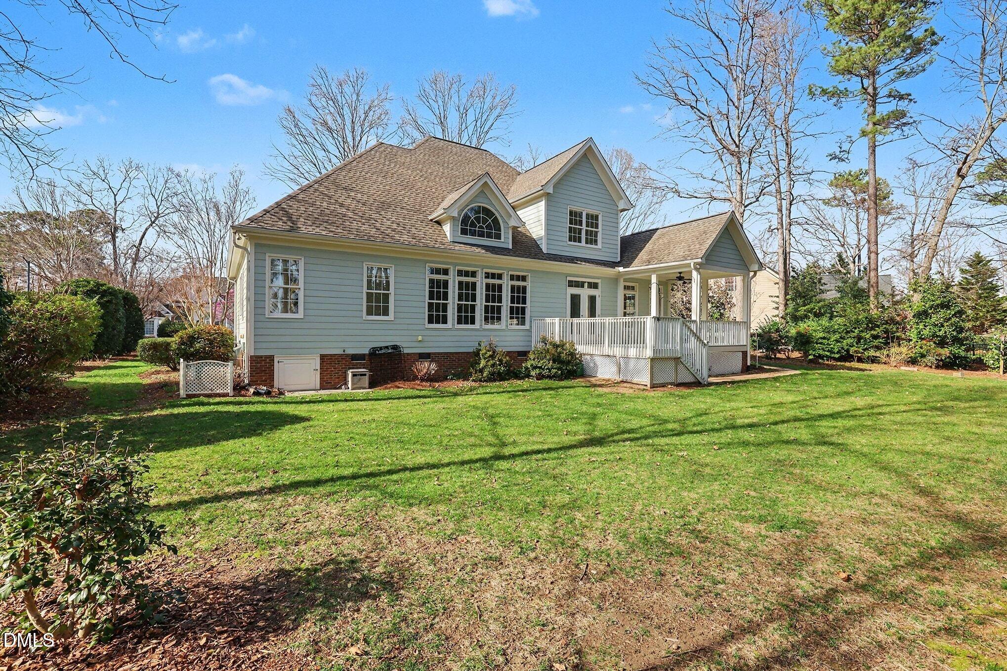 1108 Neuse Ridge Drive Clayton, NC 27527 - Photo 46 of 52 a front view of a house with a yard and trees