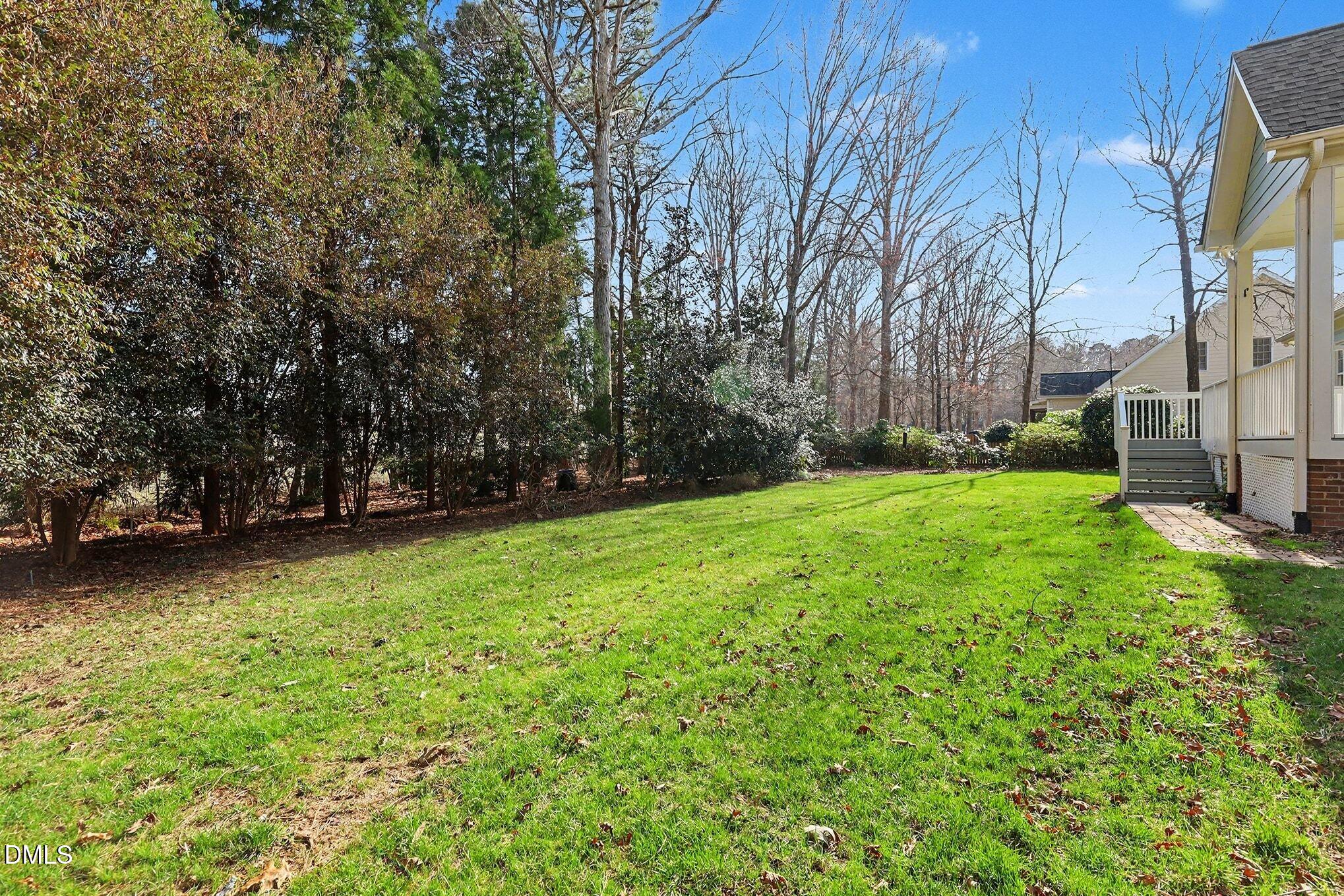 1108 Neuse Ridge Drive Clayton, NC 27527 - Photo 48 of 52 a view of a backyard with large trees