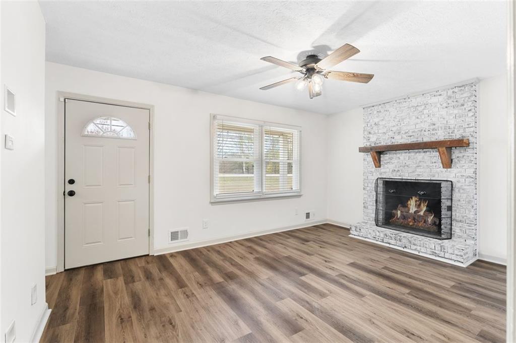 2720 North Bogan Road Northeast Buford, GA 30519 - Photo 27 of 29 a view of an empty room with window and fire place