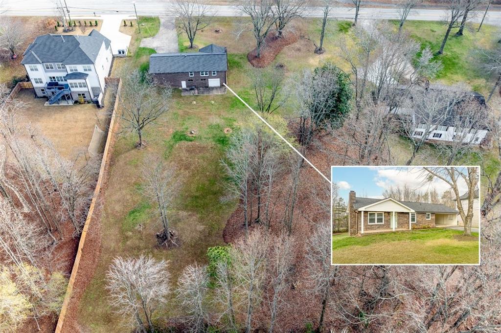 2720 North Bogan Road Northeast Buford, GA 30519 - Photo 6 of 29 an aerial view of a house with outdoor space