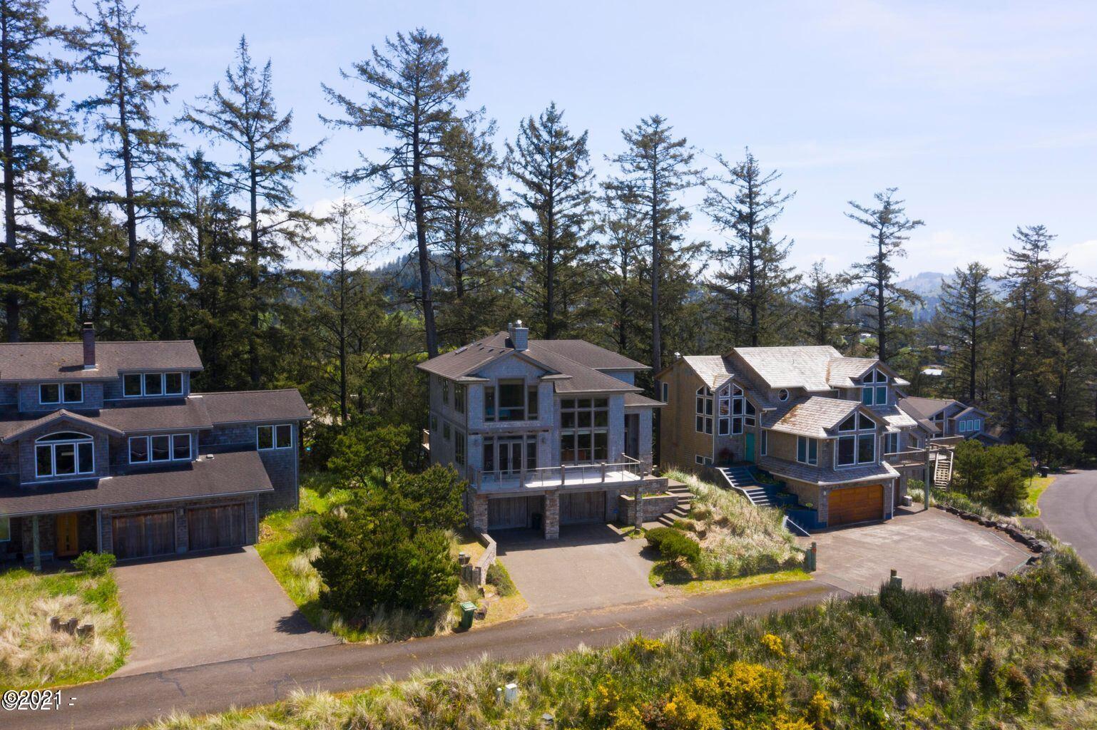 6355 Nestucca Ridge Road Pacific City, OR 97135 - Photo 2 of 20 a front view of a house with a garden