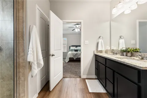 a en suite bathroom with a sink and a mirror