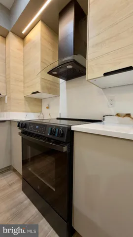 a kitchen with a sink and a refrigerator