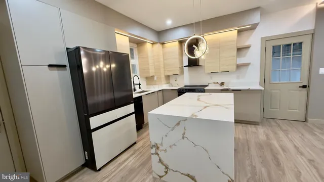 a bathroom with a sink a mirror and a shower