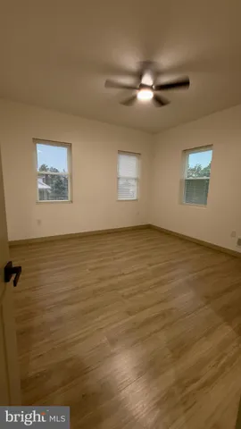 a view of gallery with wooden floor