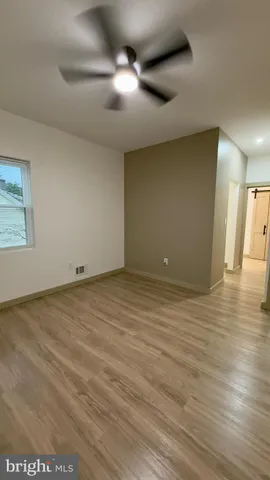 a bathroom with a glass shower door and a sink