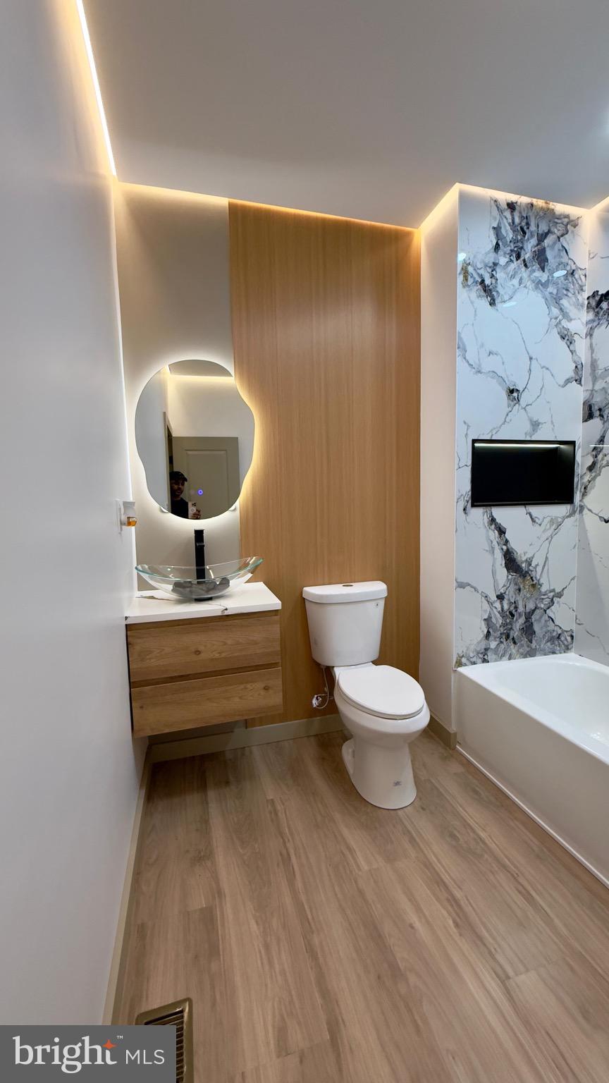 1011 Elnore Avenue Temple, PA 19560 - Photo 41 of 61 a bathroom with a toilet sink and mirror