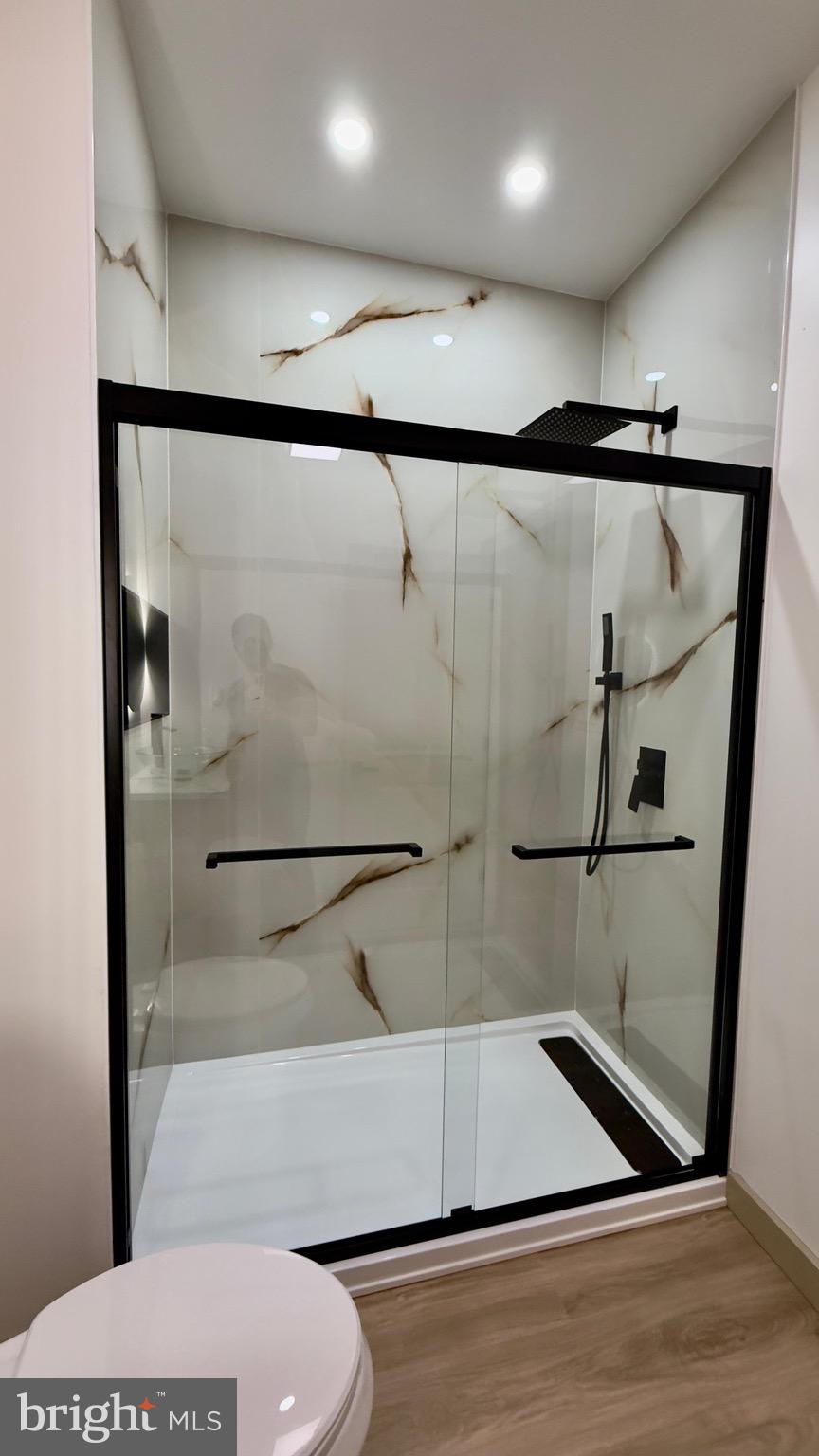 1011 Elnore Avenue Temple, PA 19560 - Photo 44 of 61 a bathroom with a glass shower door and a sink