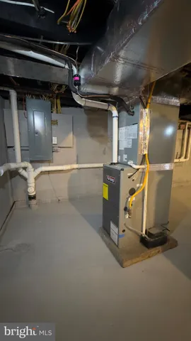 a front view of house with yard and trees around