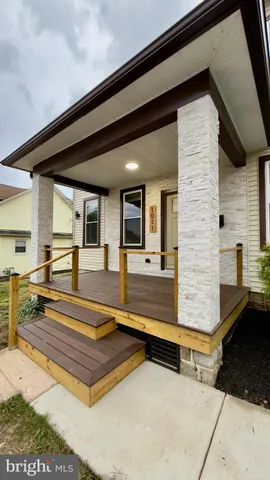 a swimming pool with outdoor seating and yard