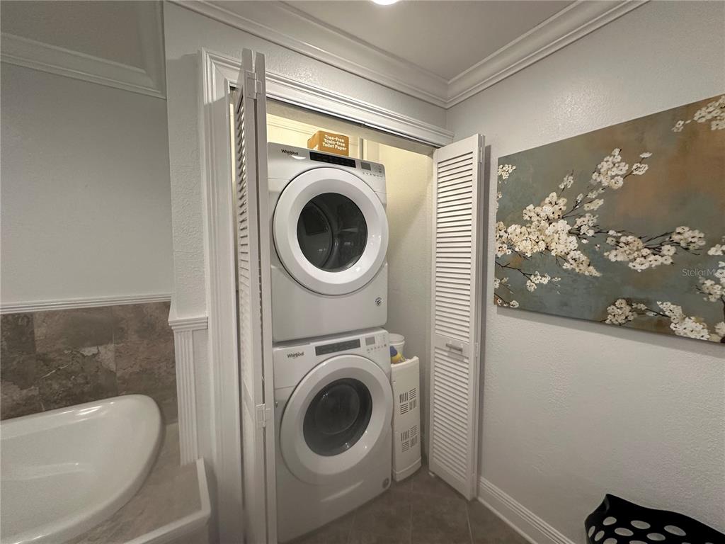104 Woden Way Winter Haven, FL 33884 - Photo 25 of 48 a utility room with dryer and washer