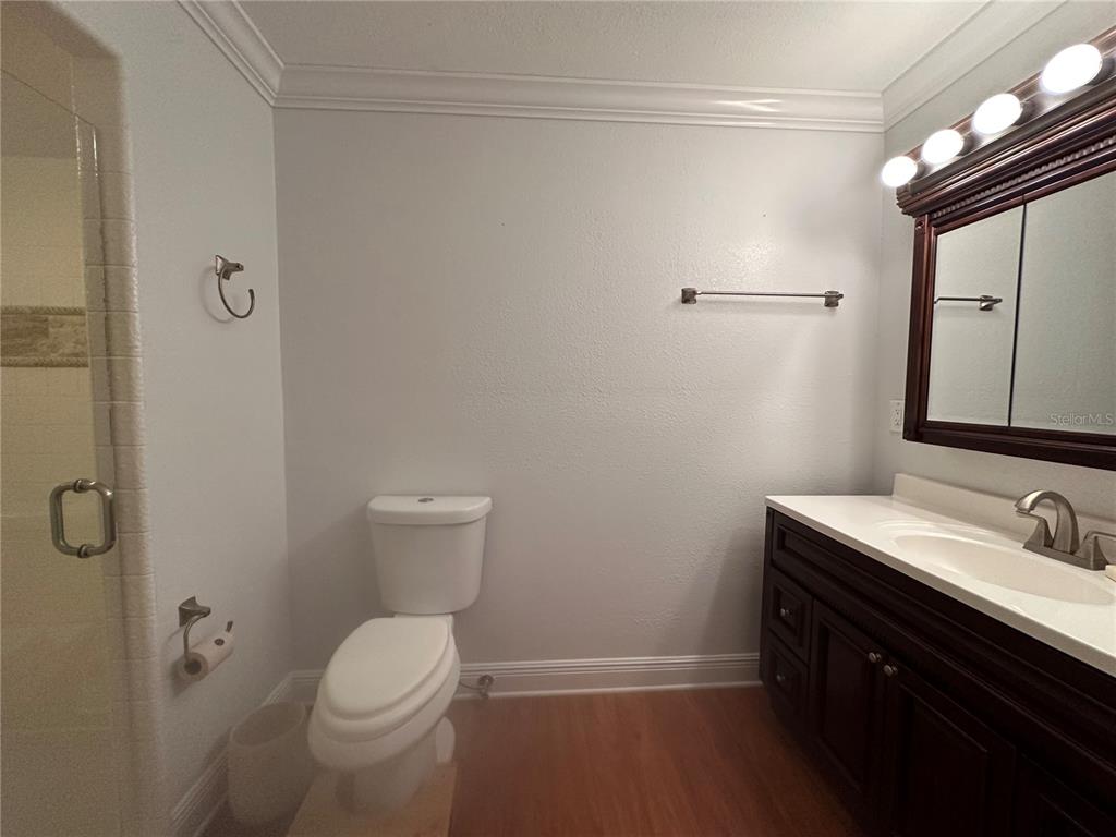104 Woden Way Winter Haven, FL 33884 - Photo 28 of 48 a bathroom with a sink a toilet and shower
