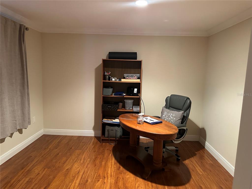 104 Woden Way Winter Haven, FL 33884 - Photo 29 of 48 a room with furniture and wooden floor