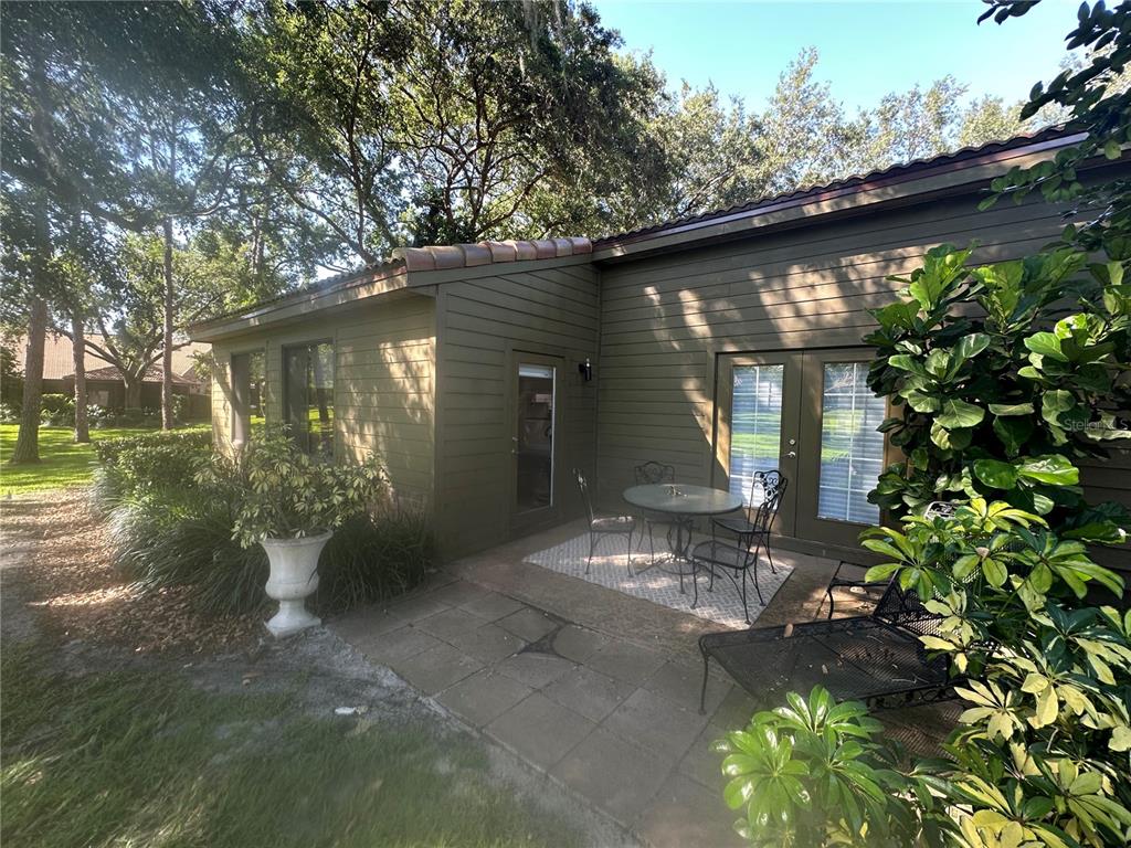 104 Woden Way Winter Haven, FL 33884 - Photo 30 of 48 a front view of a house with garden