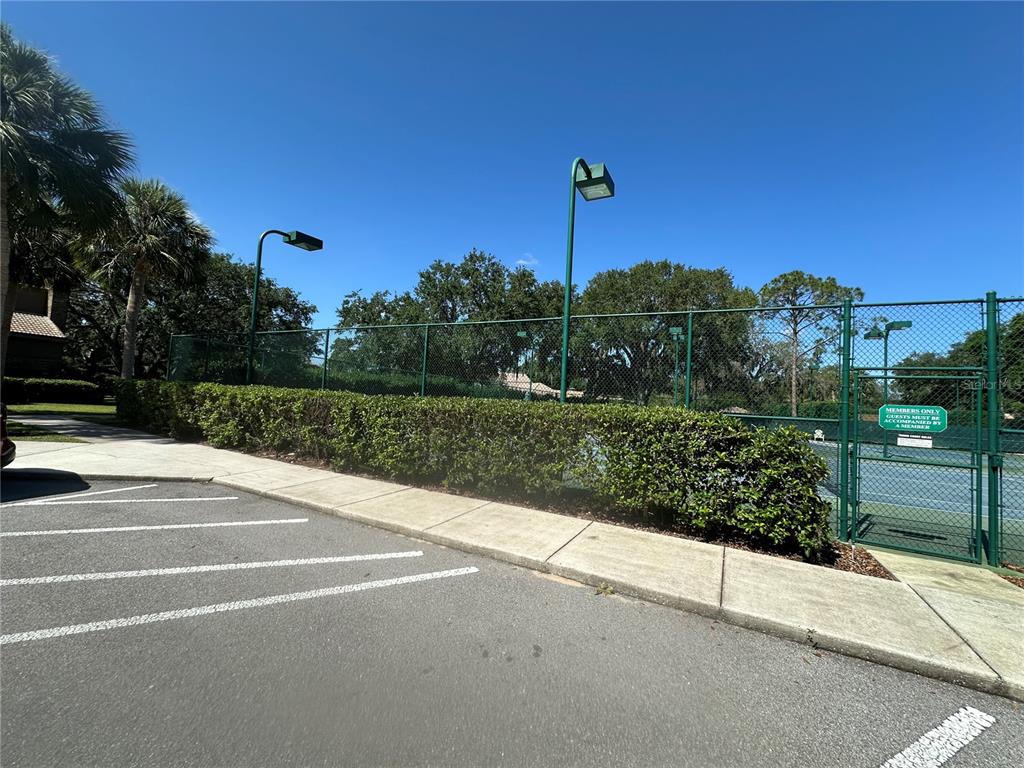 104 Woden Way Winter Haven, FL 33884 - Photo 35 of 48 a view of a street with a building in the background