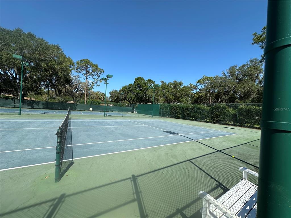 104 Woden Way Winter Haven, FL 33884 - Photo 37 of 48 a view of a tennis court