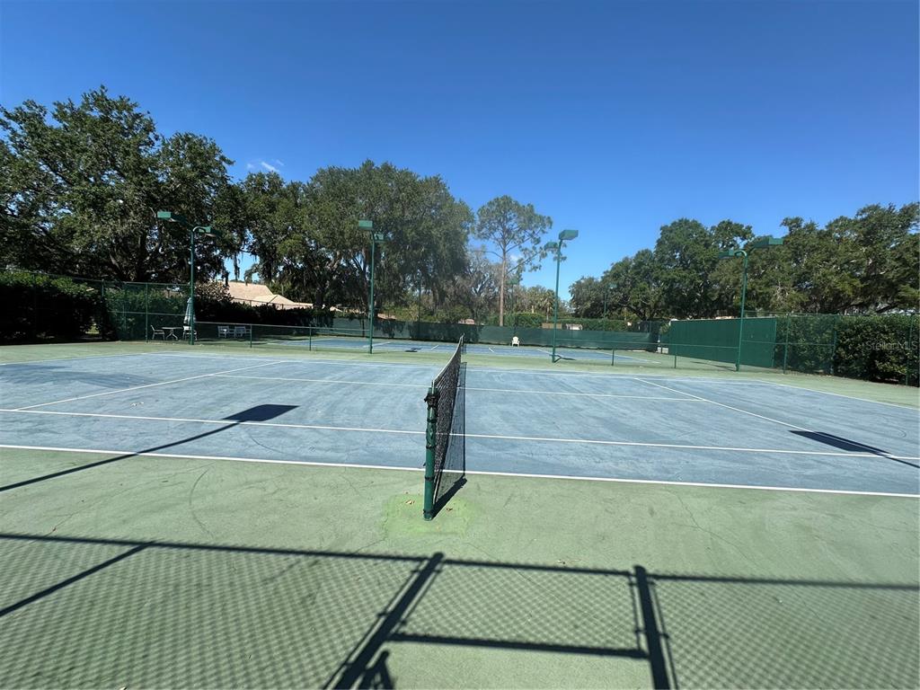 104 Woden Way Winter Haven, FL 33884 - Photo 38 of 48 a view of a tennis court