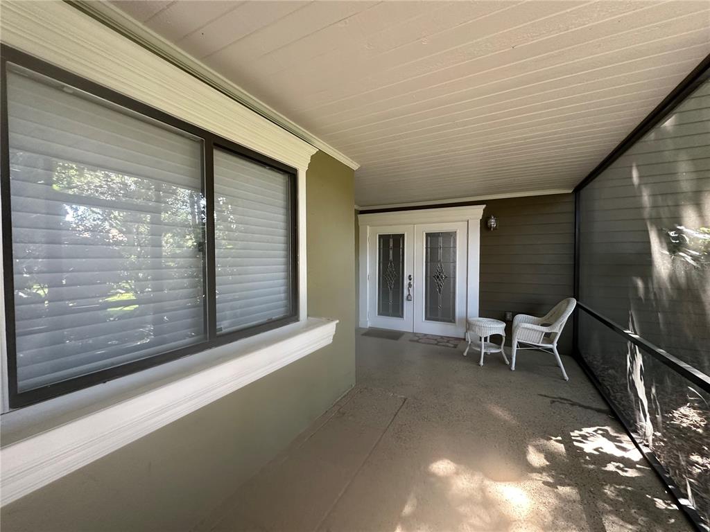 104 Woden Way Winter Haven, FL 33884 - Photo 5 of 48 a view of two chairs in the balcony