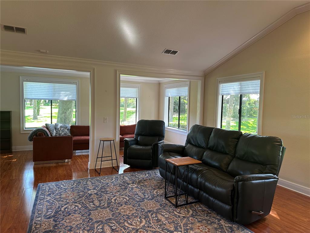 104 Woden Way Winter Haven, FL 33884 - Photo 6 of 48 a living room with furniture and wooden floor