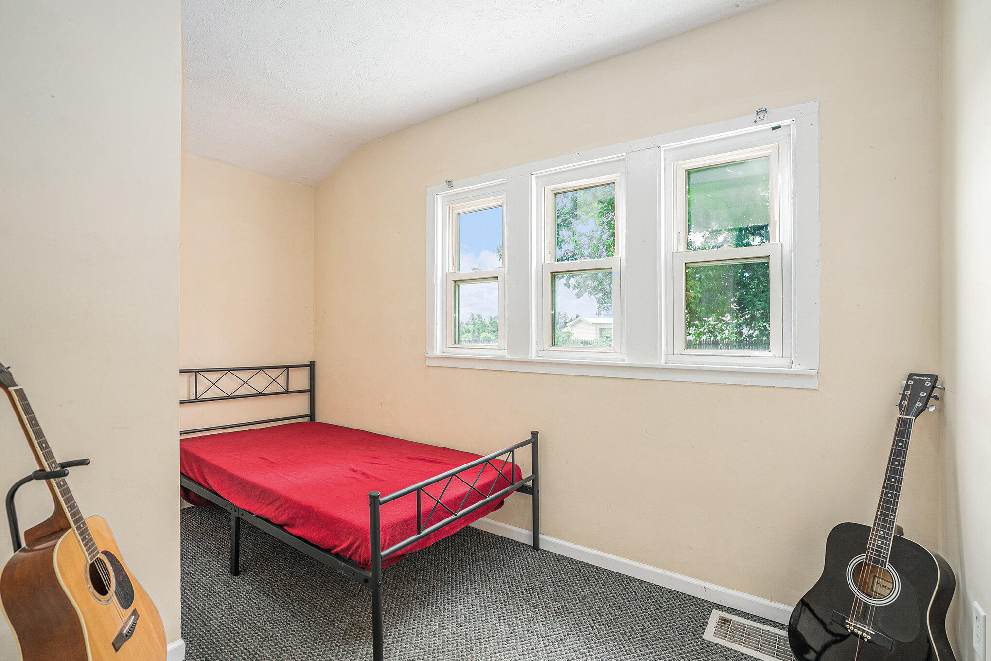 2980 18 Mile Road Northeast Cedar Springs, MI 49319 - Photo 14 of 26 Main level bedroom 1