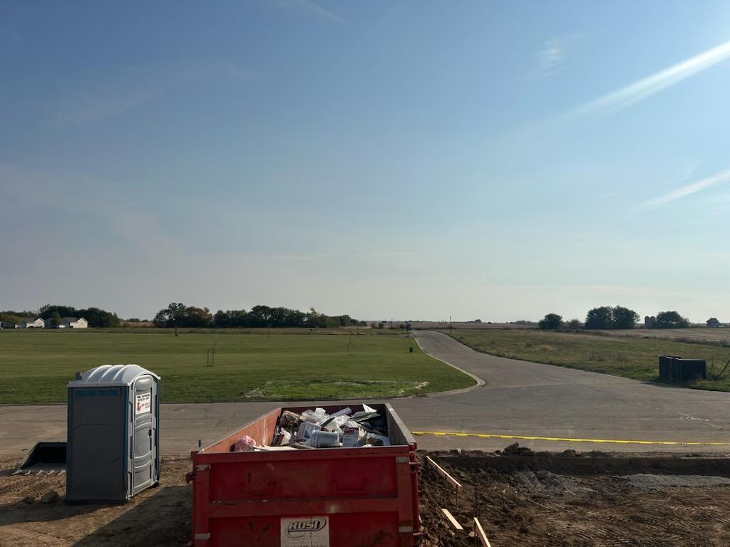 667 South Regulators Street Rochelle, IL 61068 - Photo 3 of 4 a view of a lake with couches in front of it