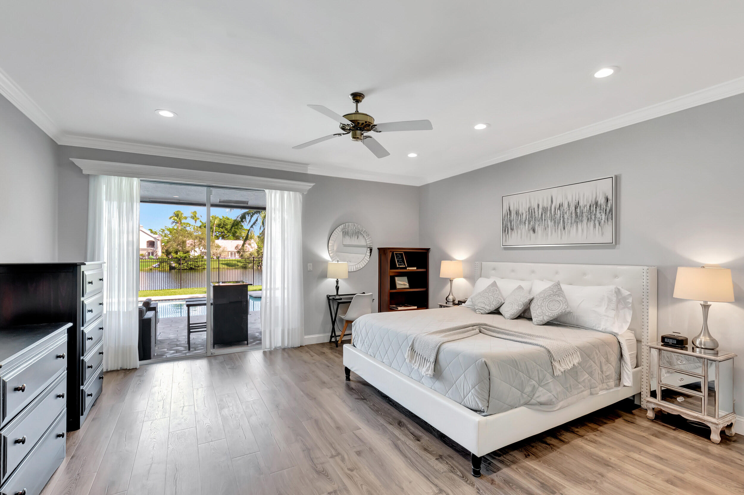 2677 Northwest 46th Street Boca Raton, FL 33434 - Photo 20 of 52 PRIMARY BEDROOM WITH POOL & LAKE VIEWS