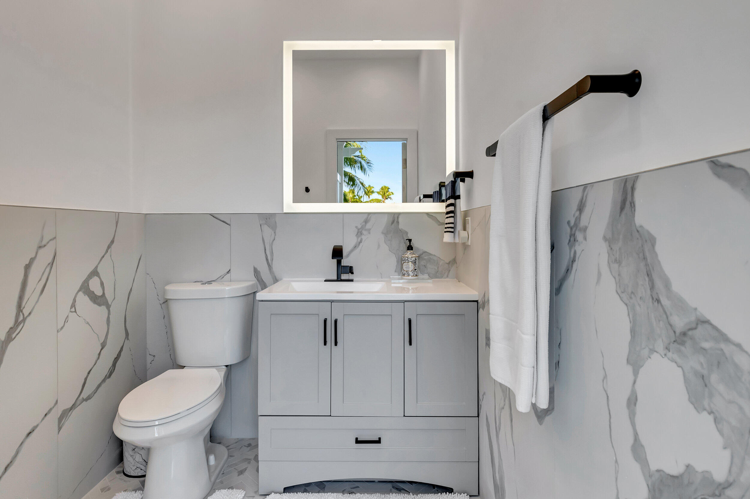 2677 Northwest 46th Street Boca Raton, FL 33434 - Photo 37 of 52 HALF BATH OFF POOL AREA